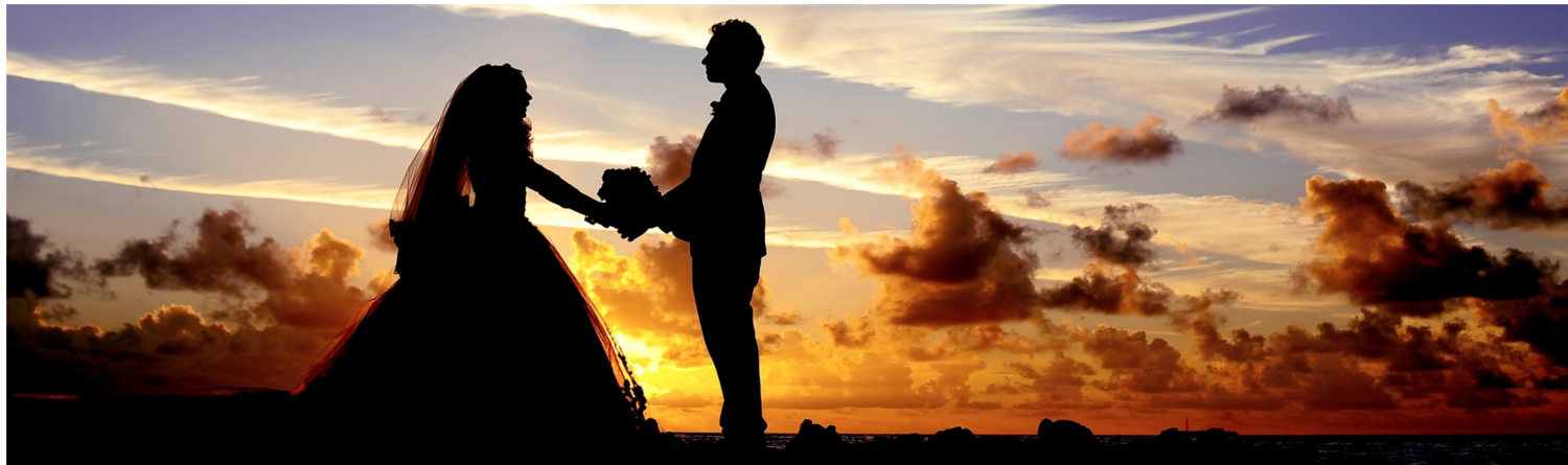 married couple in sunset